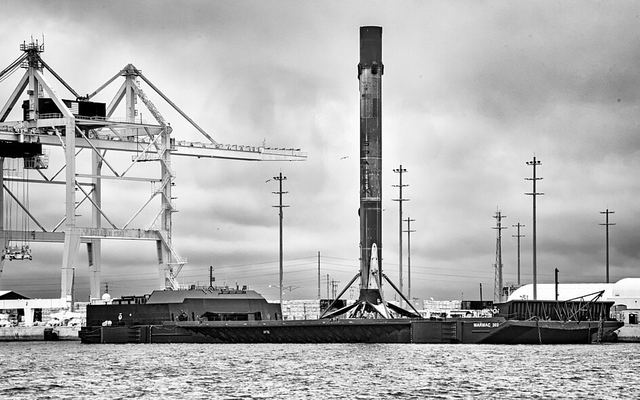 A Falcon 9 booster standing on a SpaceX droneship at Port Canaveral
